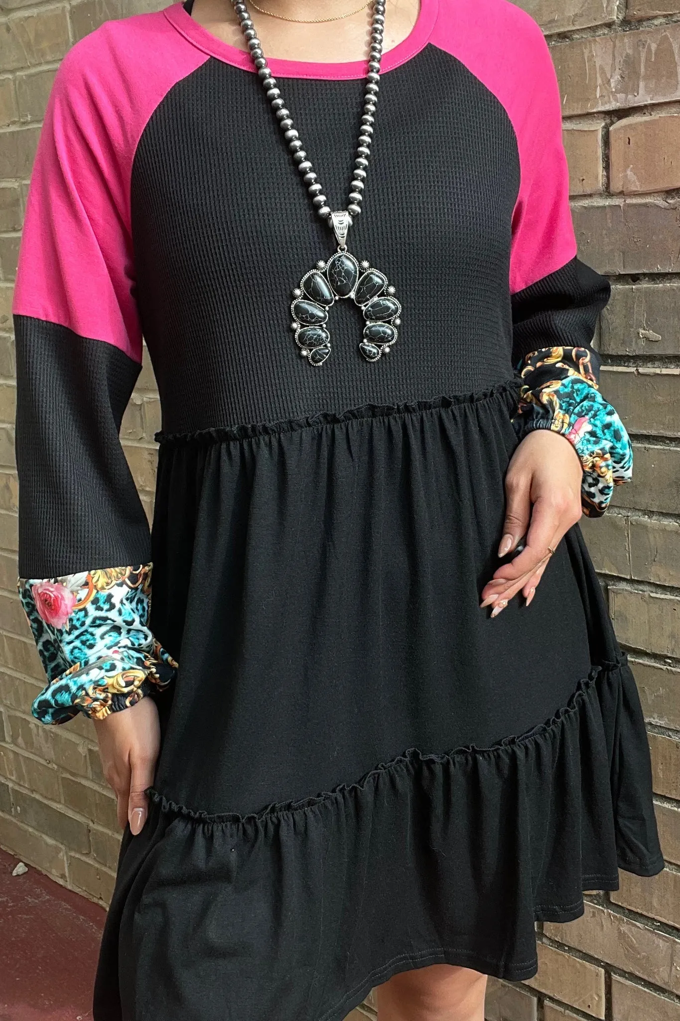 Black Ruffle Dress with pink shoulders and printed sleeve